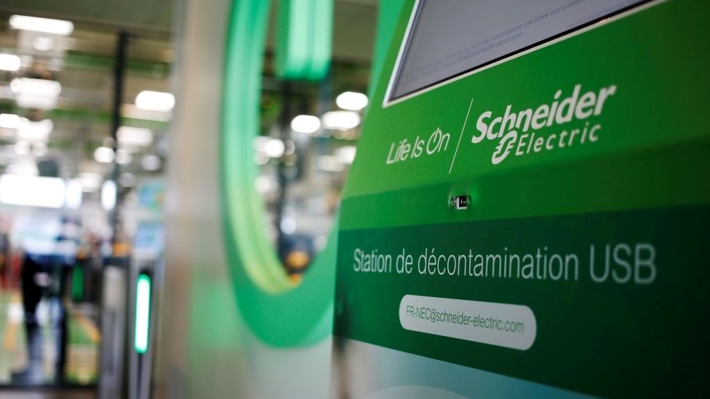 A close up photo of a terminal on a factor floor showing the Schneider Electric logo