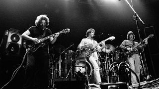 View of, from left, American Rock musicians Jerry Garcia (1942 - 1995) and Bob Weir, both on guitar, and Phil Lesh, on bass guitar, all of the group Grateful Dead, as they perform onstage at Nassau Coliseum (later Nassau Veterans Memorial Coliseum), Uniondale, New York, November 1, 1979