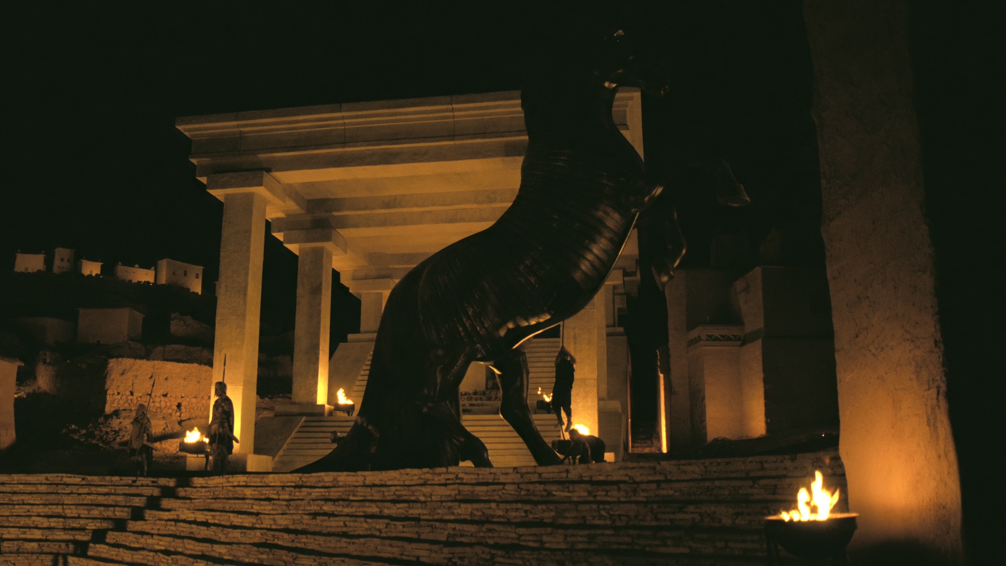 The Trojan Horse set up inside Troy at night in The Odyssey