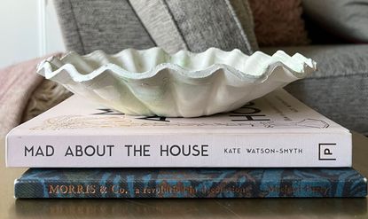 Anthro-esque DIY ruffle bowl stages on round coffee table with books