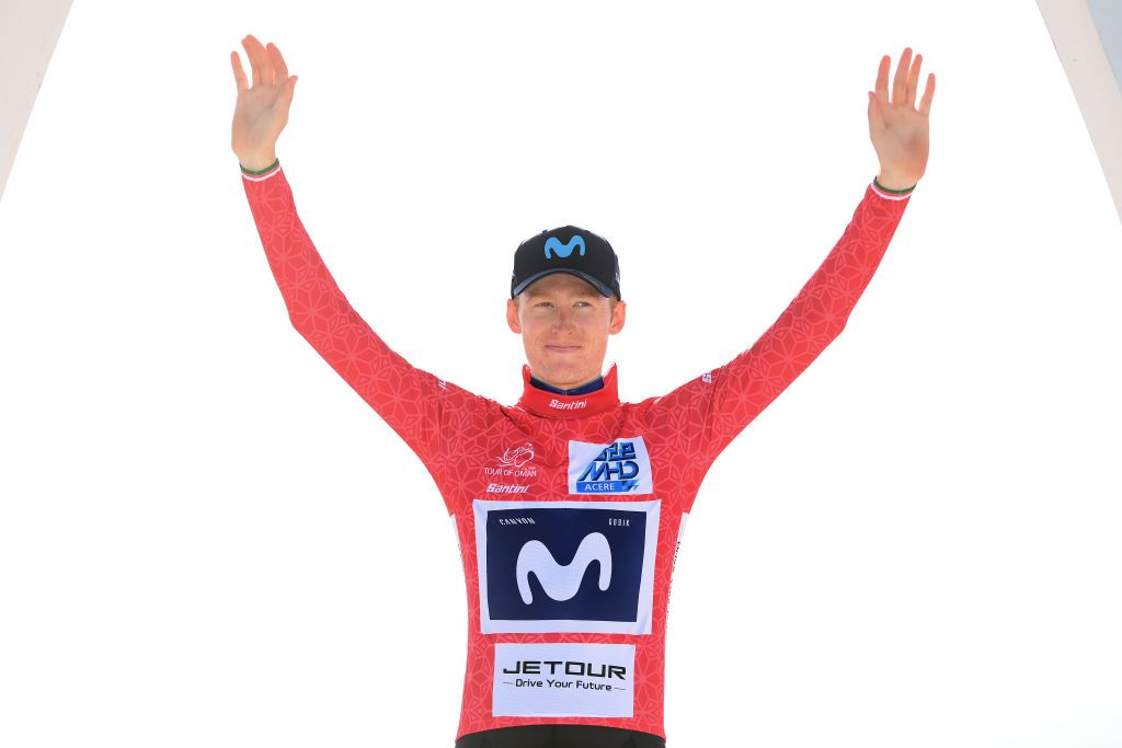 American Matteo Jorgenson (Movistar) on the podium in the race winner&#039;s red jersey at the 2023 Tour of Oman
