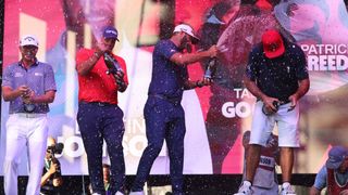 Team Captain Dustin Johnson of 4 Aces GC celebrates with teammates Pat Perez, Talor Gooch and Patrick Reed after the 2022 LIV Golf Chicago event