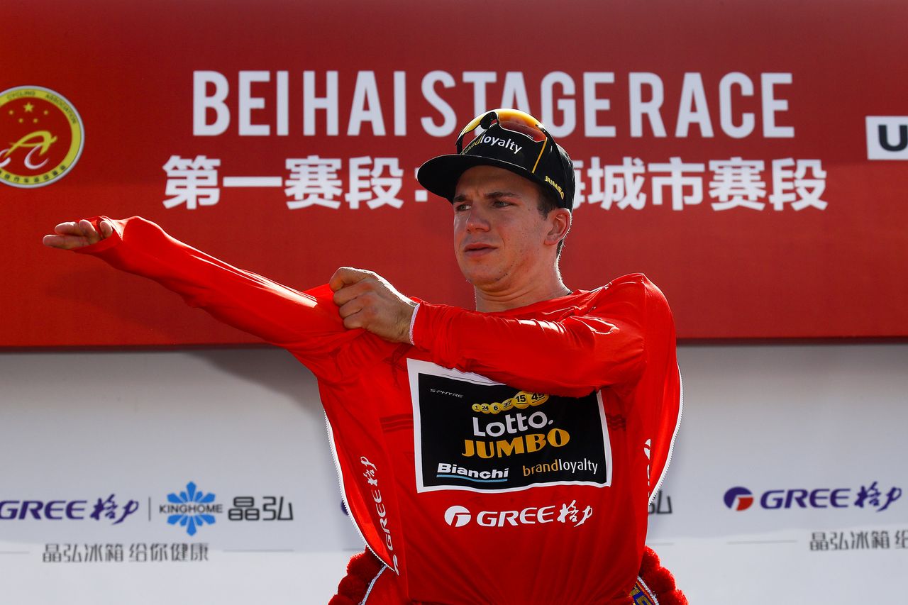 Dylan Groenewegen (LottoNL-Jumbo) pulls on the leader's red jersey