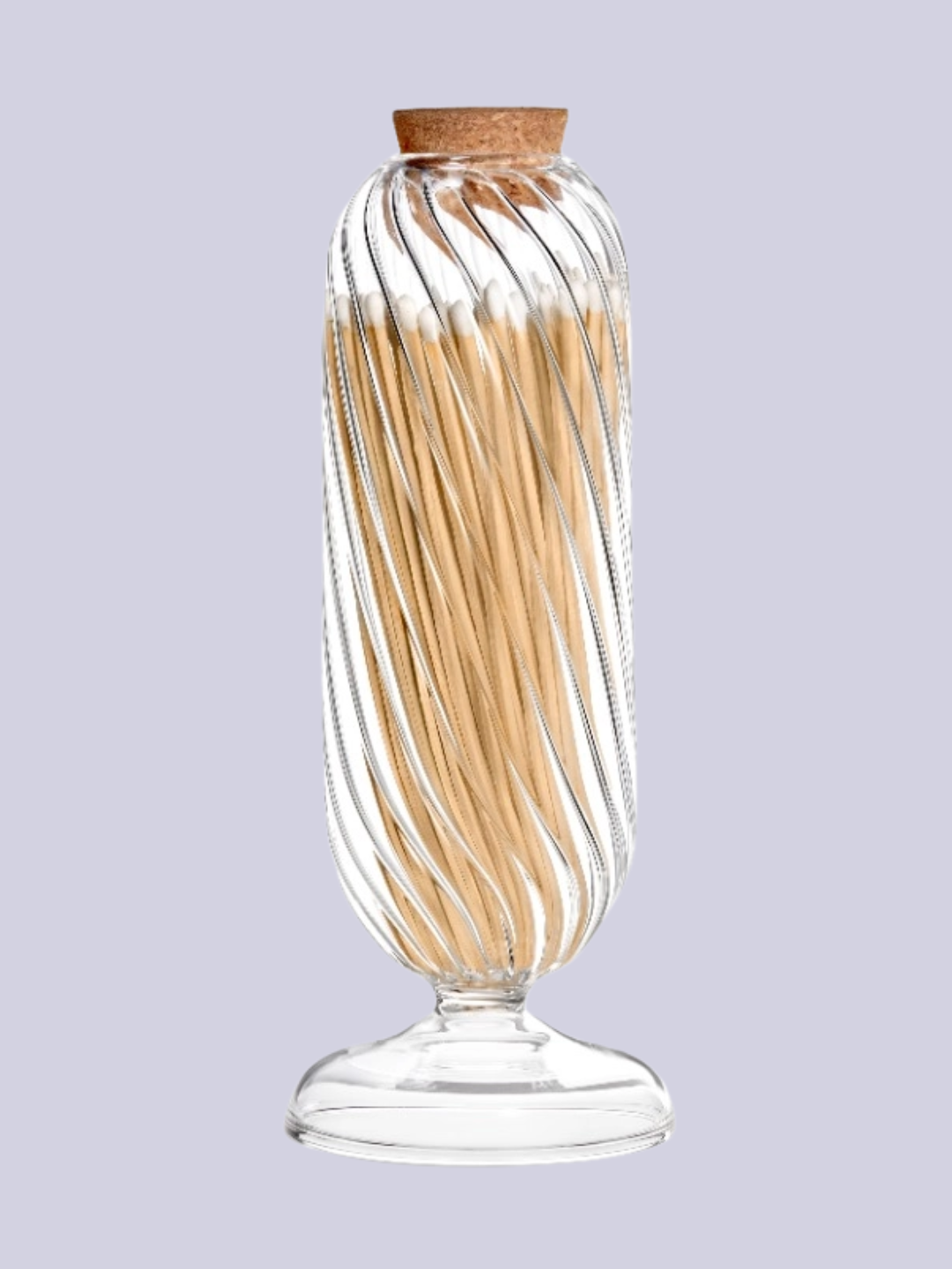 A glass match holder with a cork stopper and striker from Diptyque