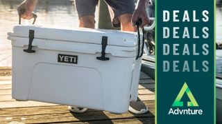 Man carrying Yeti Tundra cooler