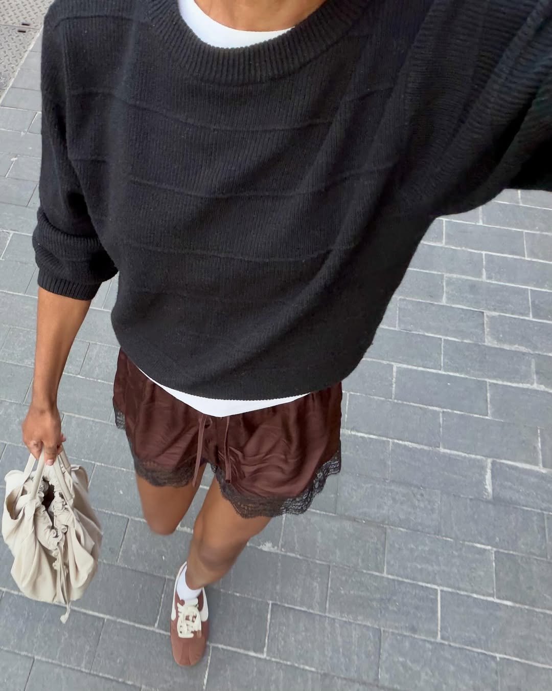 @louisahatt wears brown silk shorts brown trainers
