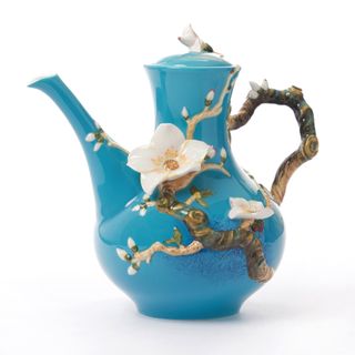 A blue Franz Collection tea pot with 3D almond blossoms and roots