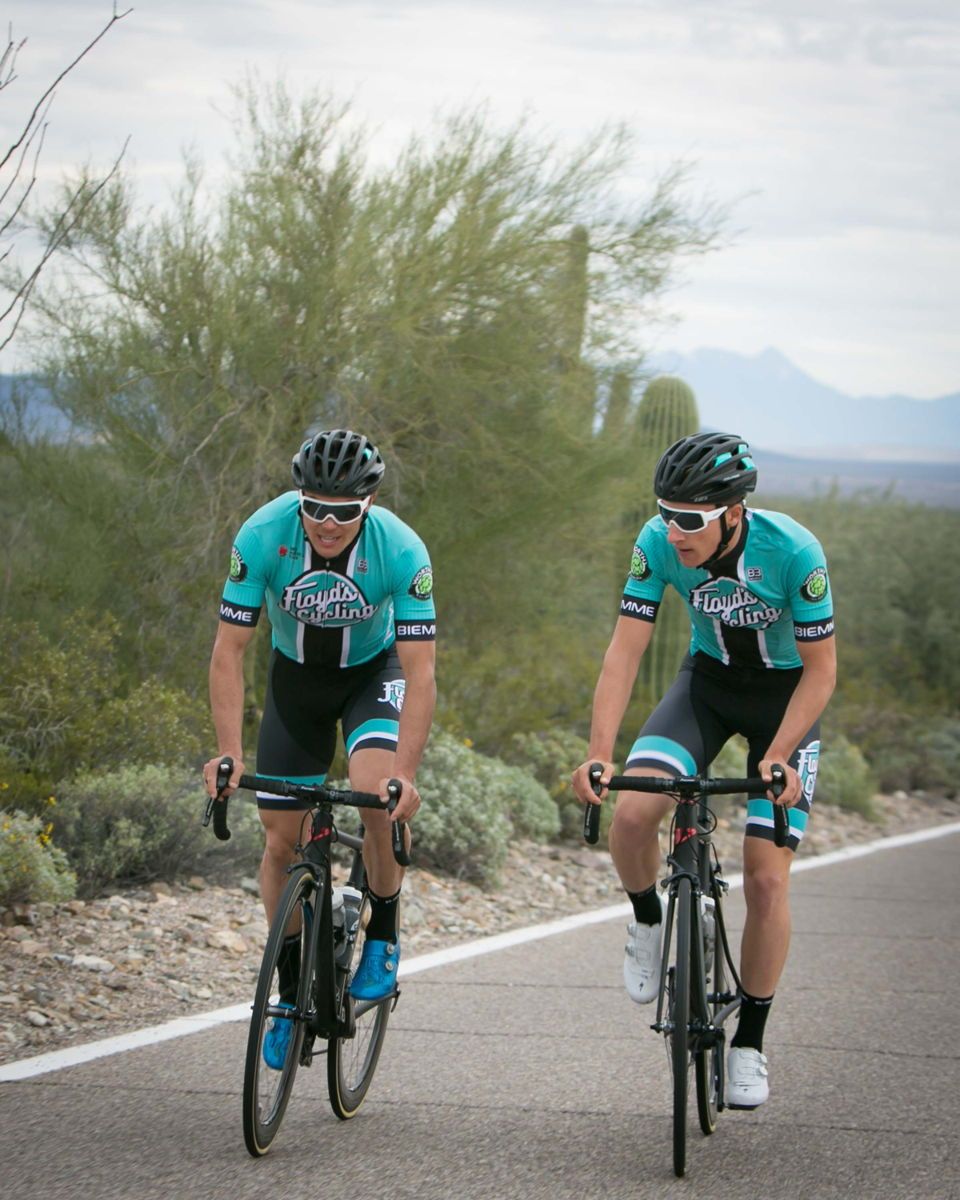 Travis McCabe and Nick Zukowsky train in the Floyd's Pro Cycling 2019 team kit