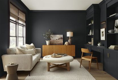 a room painted in a dark grey black wall paint
