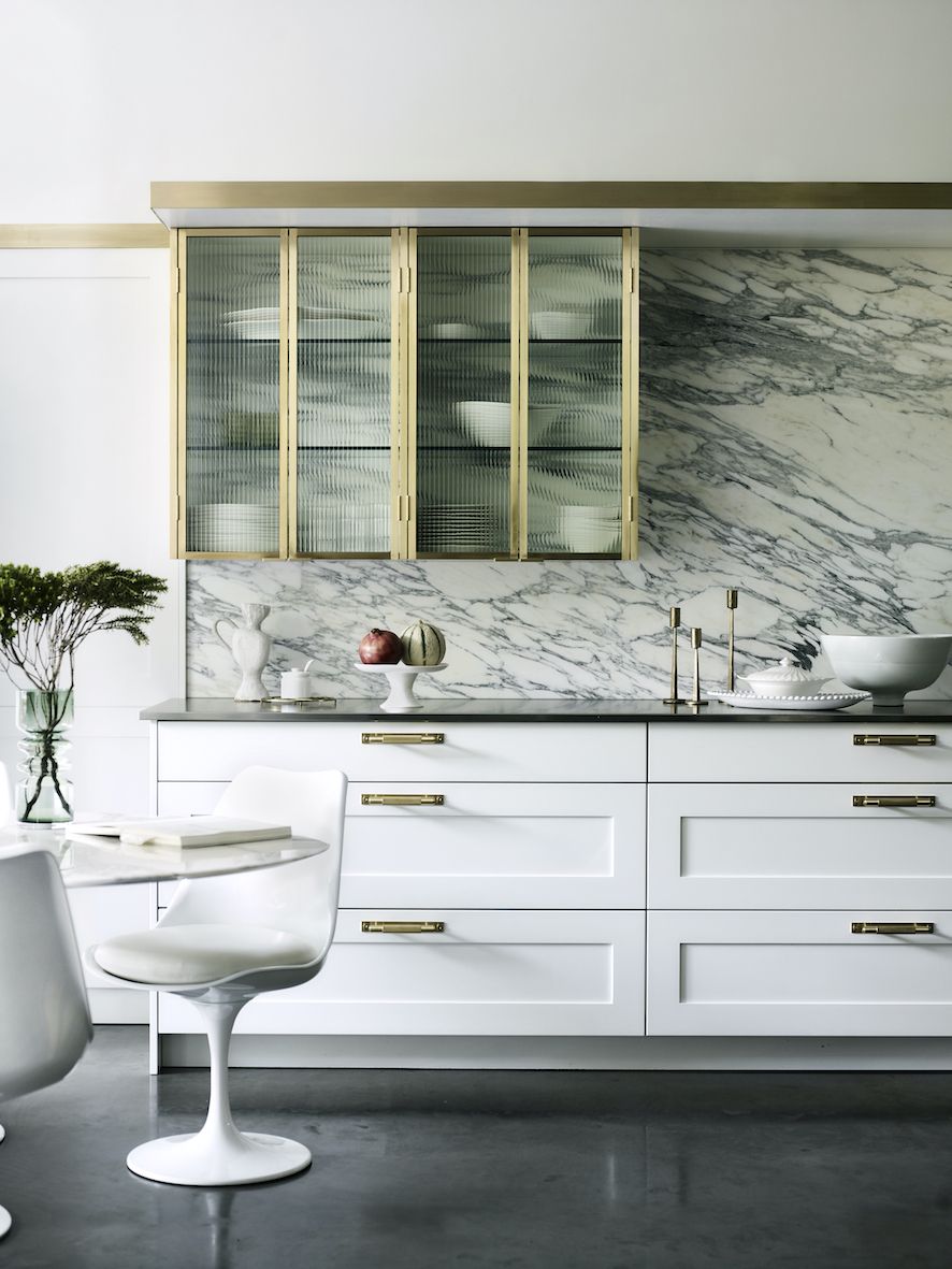 White kitchen with marble splashback
