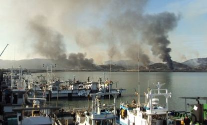 Smoke rises from Yoenpyeong Island after North Korea fired dozens of artillery shells onto the South Korean island.