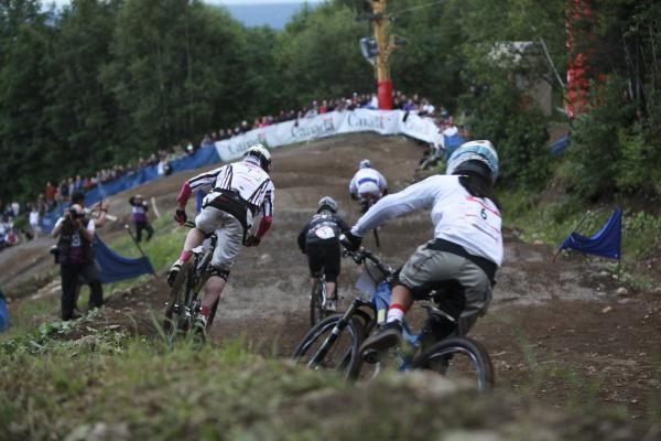 Racers zoom down the four cross course.