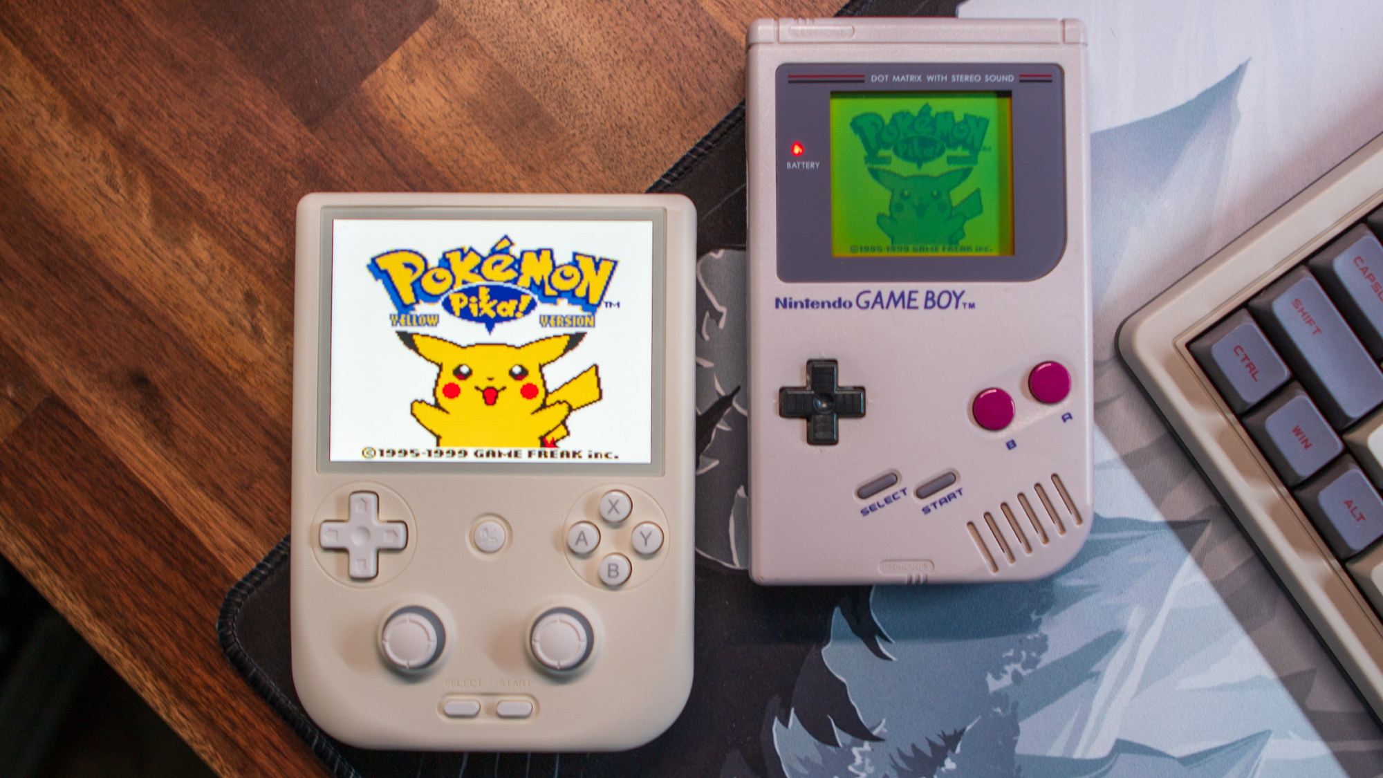 Anbernic RG406V next to Game Boy DMG playing Pokemon Yellow