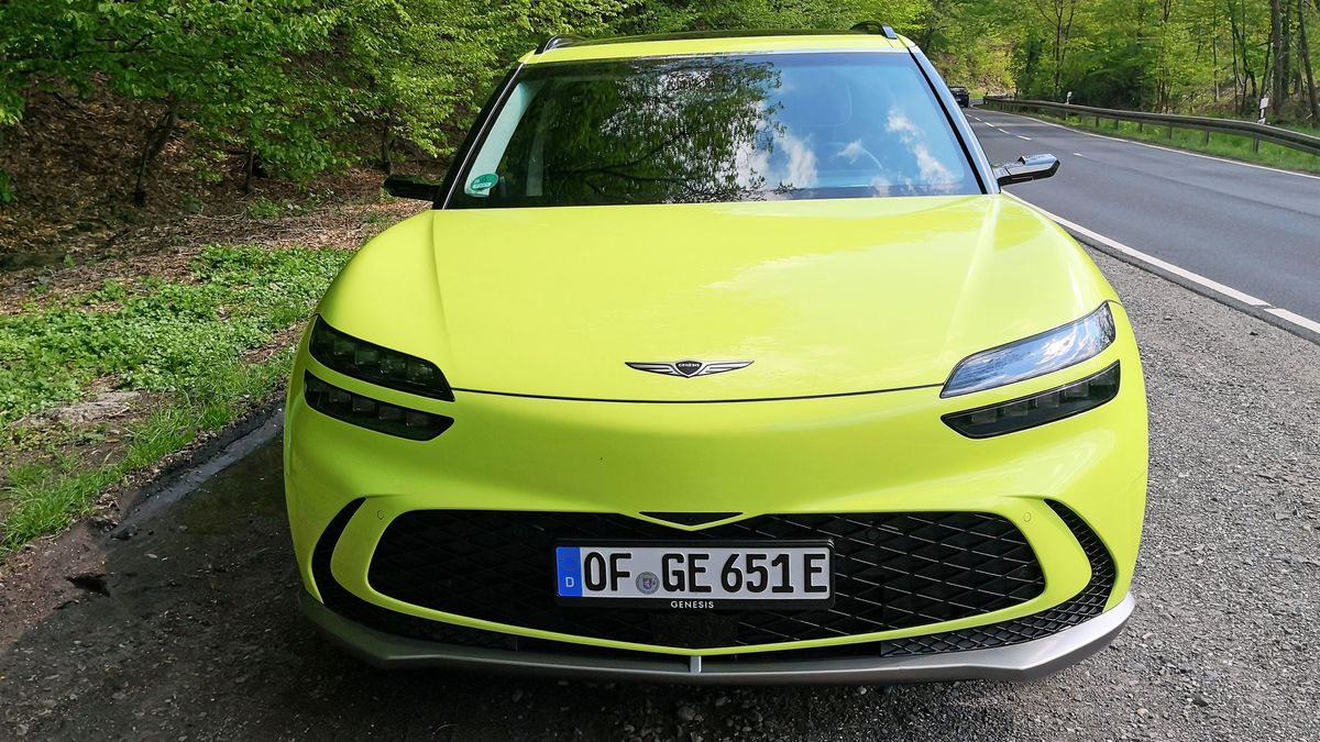 Front view of green GV60 parked at side of road