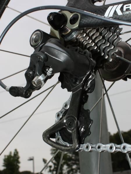The new Dura-Ace rear derailleur uses a carbon fiber pulley cage.