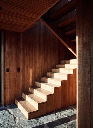 Internal wood stairs with stone flooring