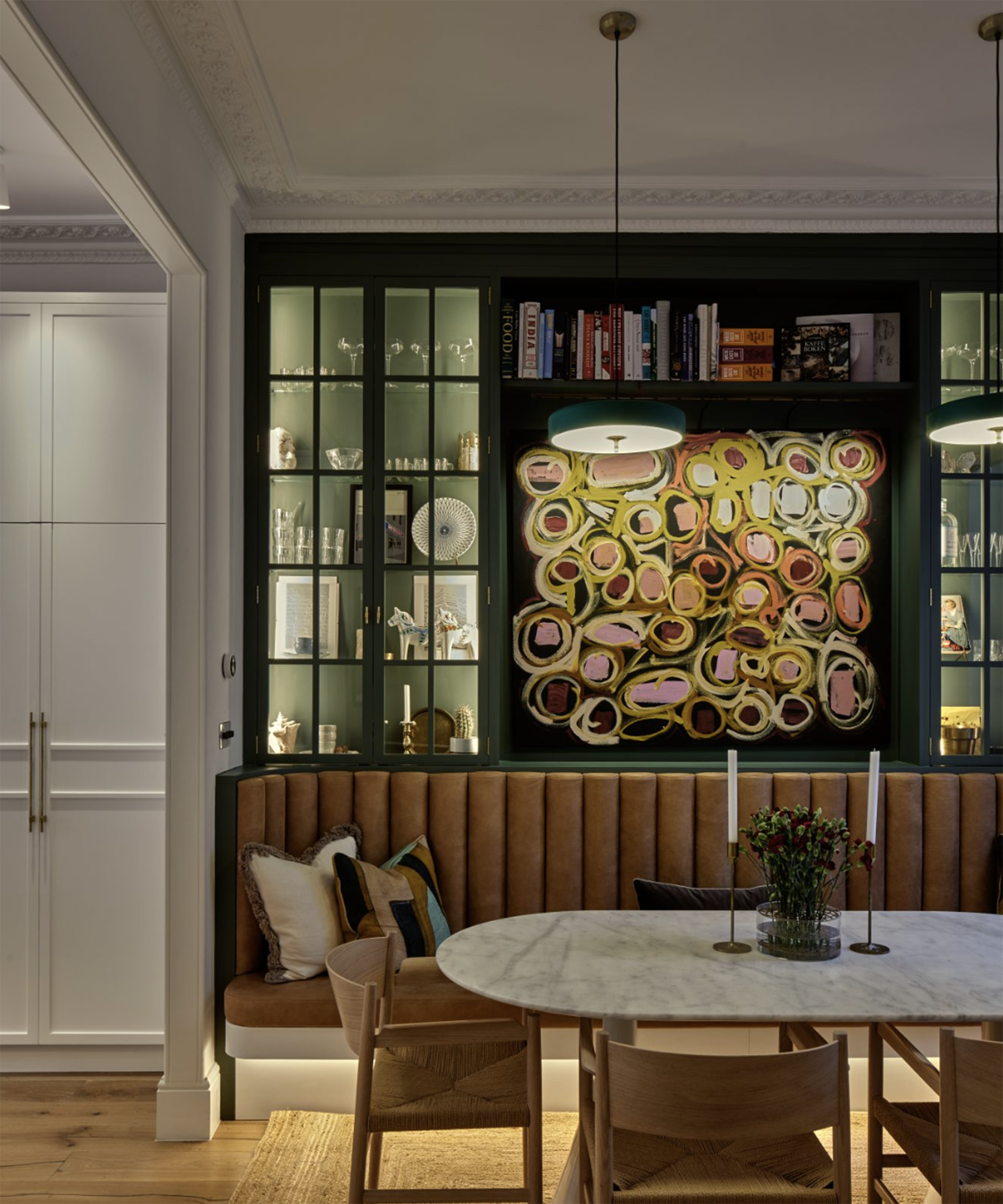 kitchen diner with lights hanging over the table