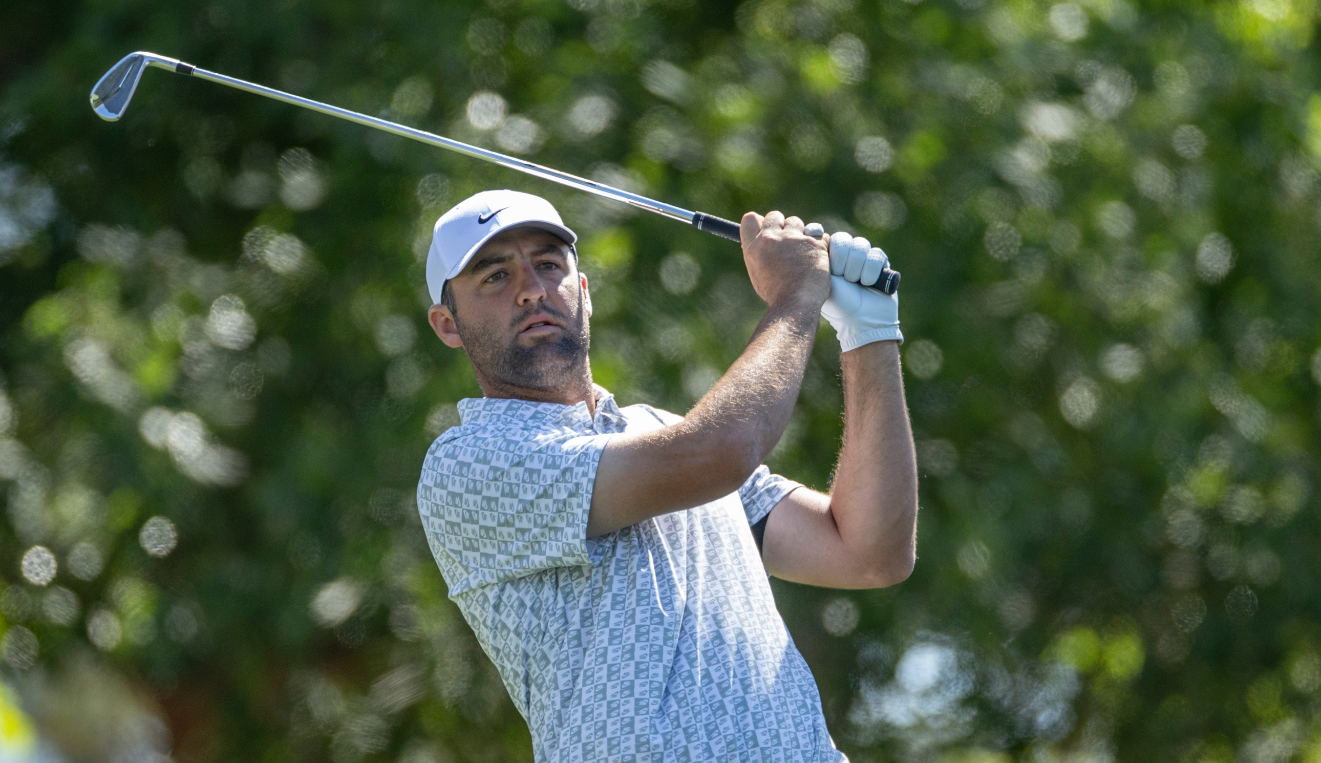 Scottie Scheffler hits an iron shot