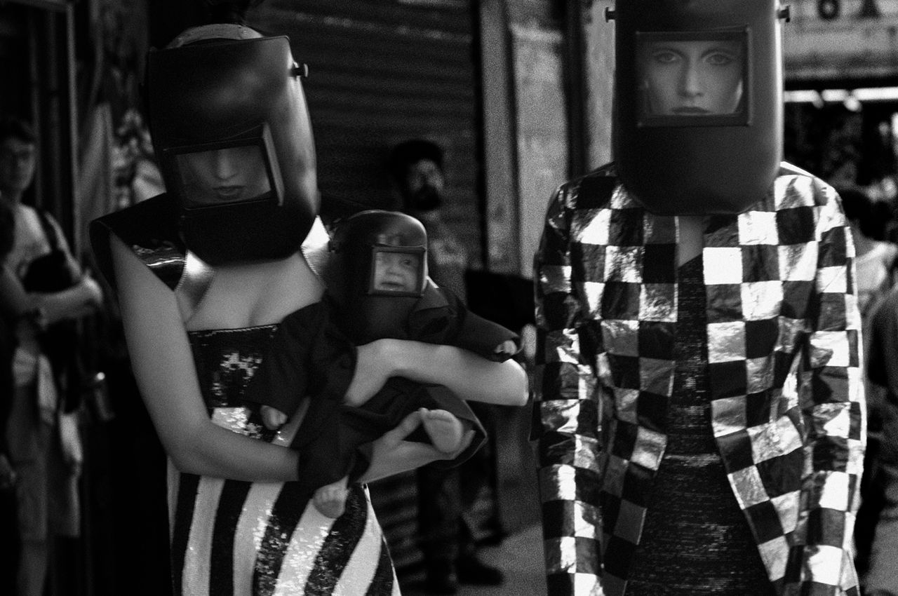 Black and white photograph of child in riot gear