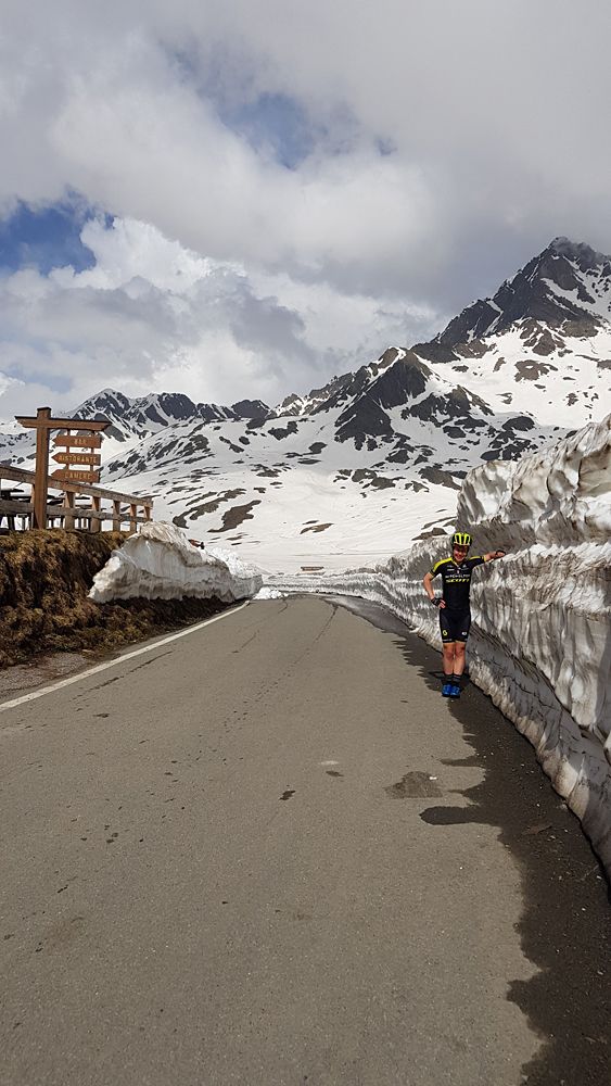 Snow lines the side of the roads at the top of the Passo Gavia