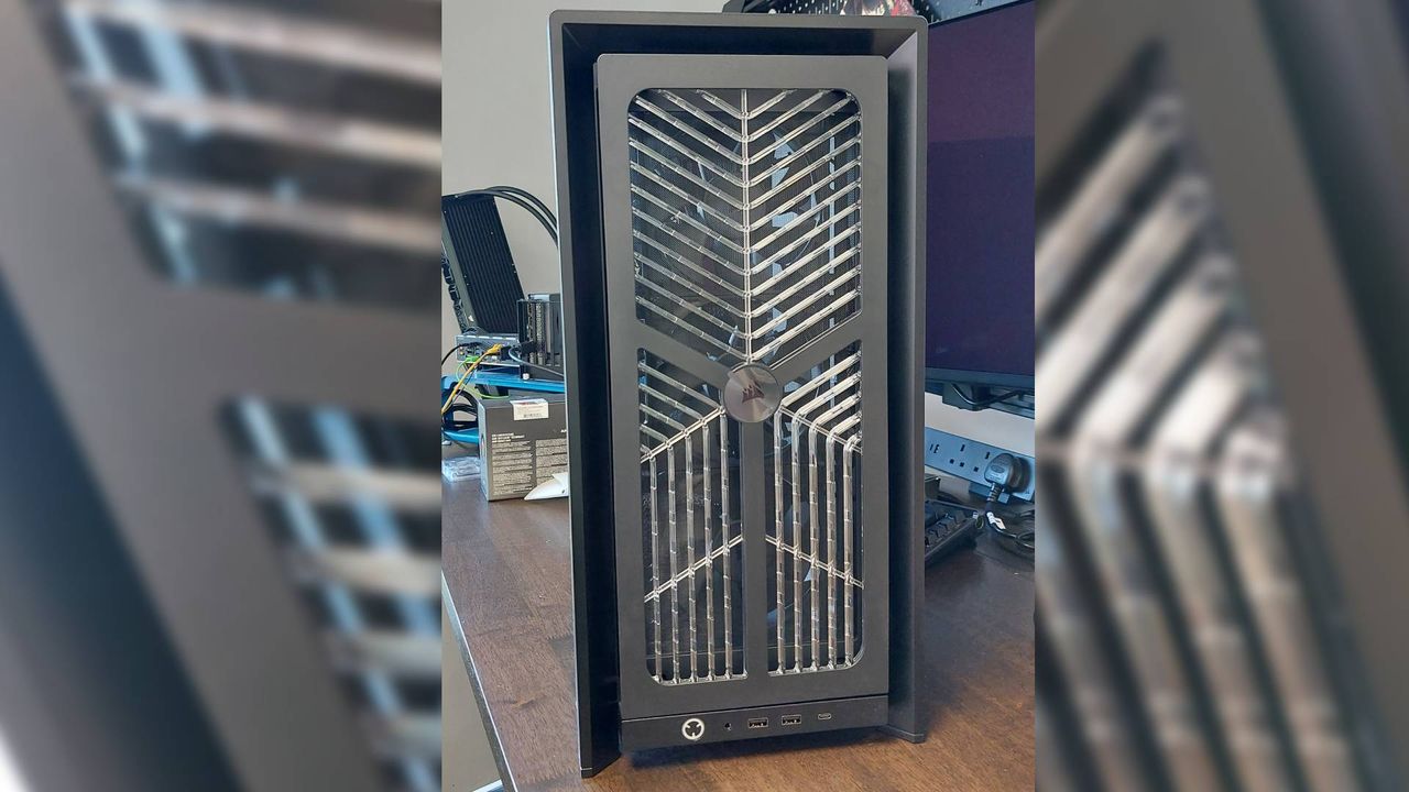 The Corsair Frame 4000X PC case seen at various stages of a PC build. This is a modular, mid-tower case with lots of options for customisation.