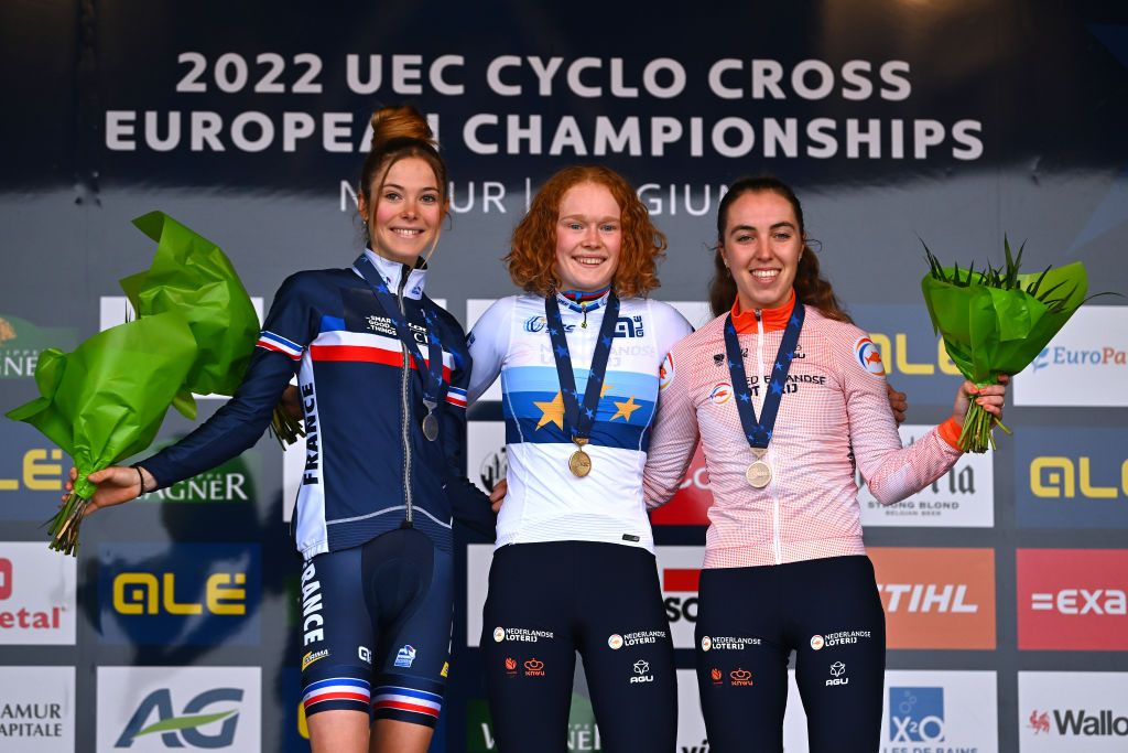 NAMUR BELGIUM NOVEMBER 06 LR Silver medalist Line Burquier of France gold medalist Puck Pieterse of The Netherlands and bronze medalist Shirin Van Anrooij of The Netherlands pose on the podium during the medal ceremony after the 20th UEC European Cyclocross Championships 2022 Womens U23 EuroCross22 on November 06 2022 in Namur Belgium Photo by Luc ClaessenGetty Images