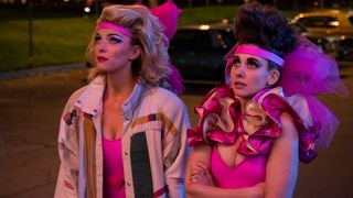 Betty Gilpin and Allison Brie in pink costumes in GLOW