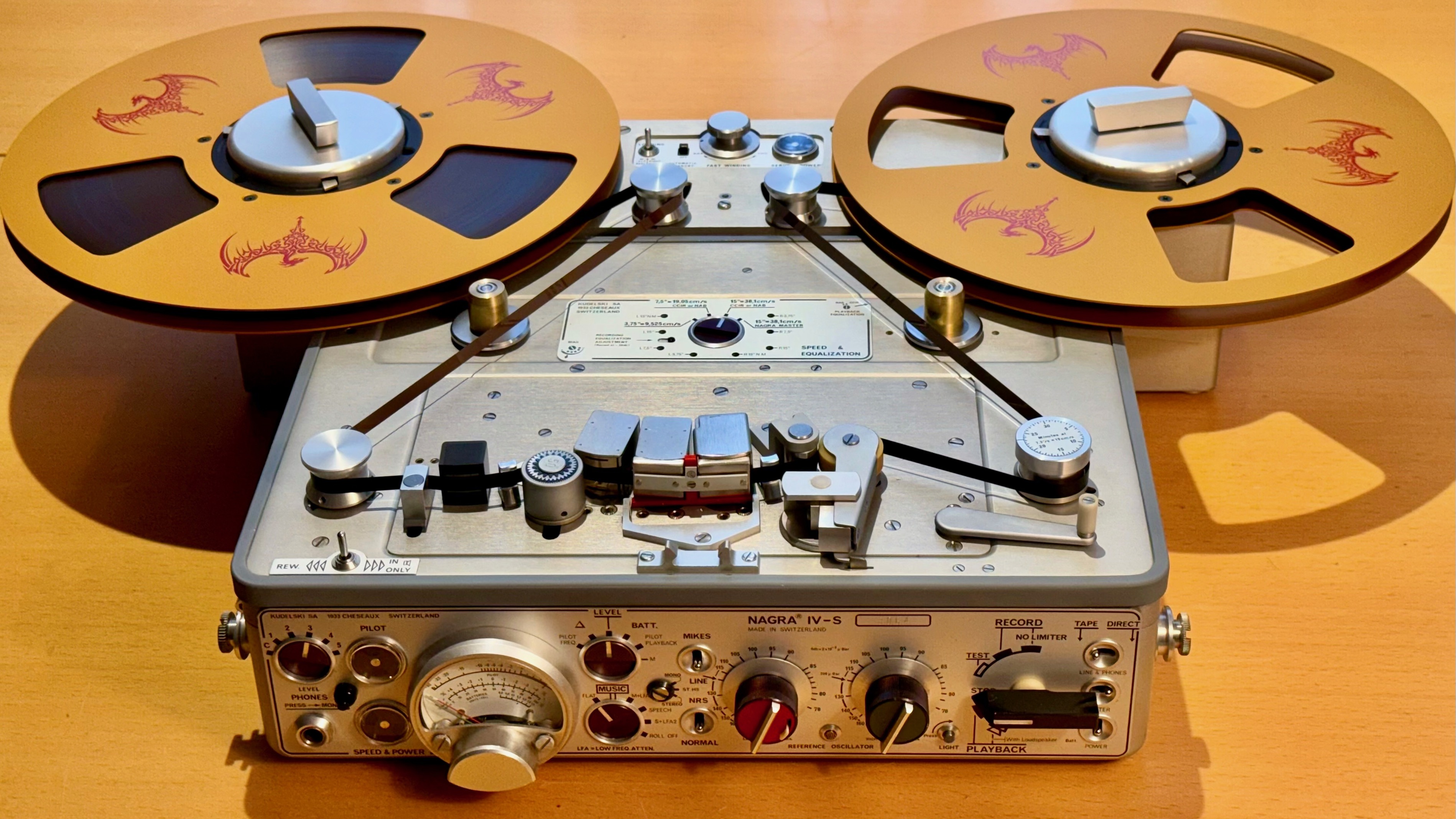 A Nagra IV-S reel-to-reel tape machine fitted with custom Chasing The Dragon spools.
