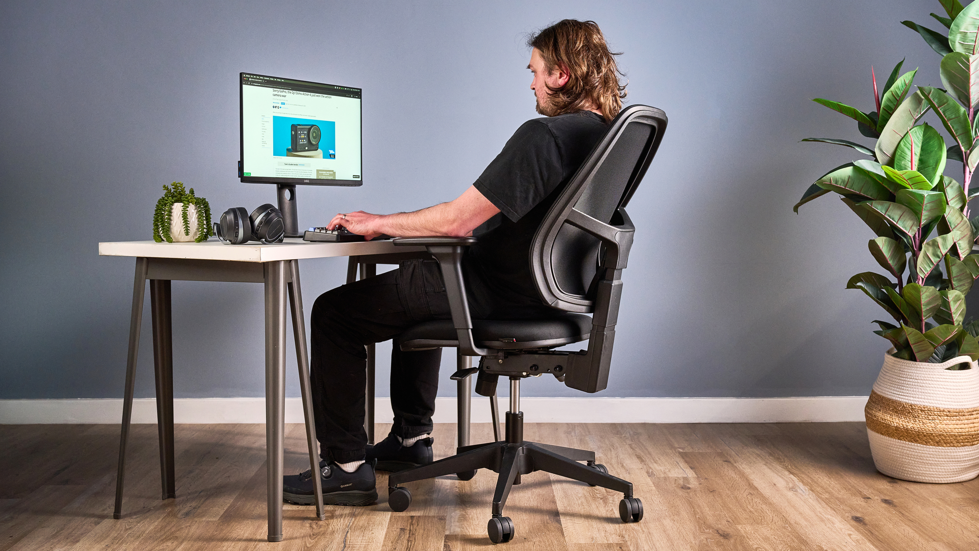 Man sat in Boulies OP180 home office chair photographed in front of a desk