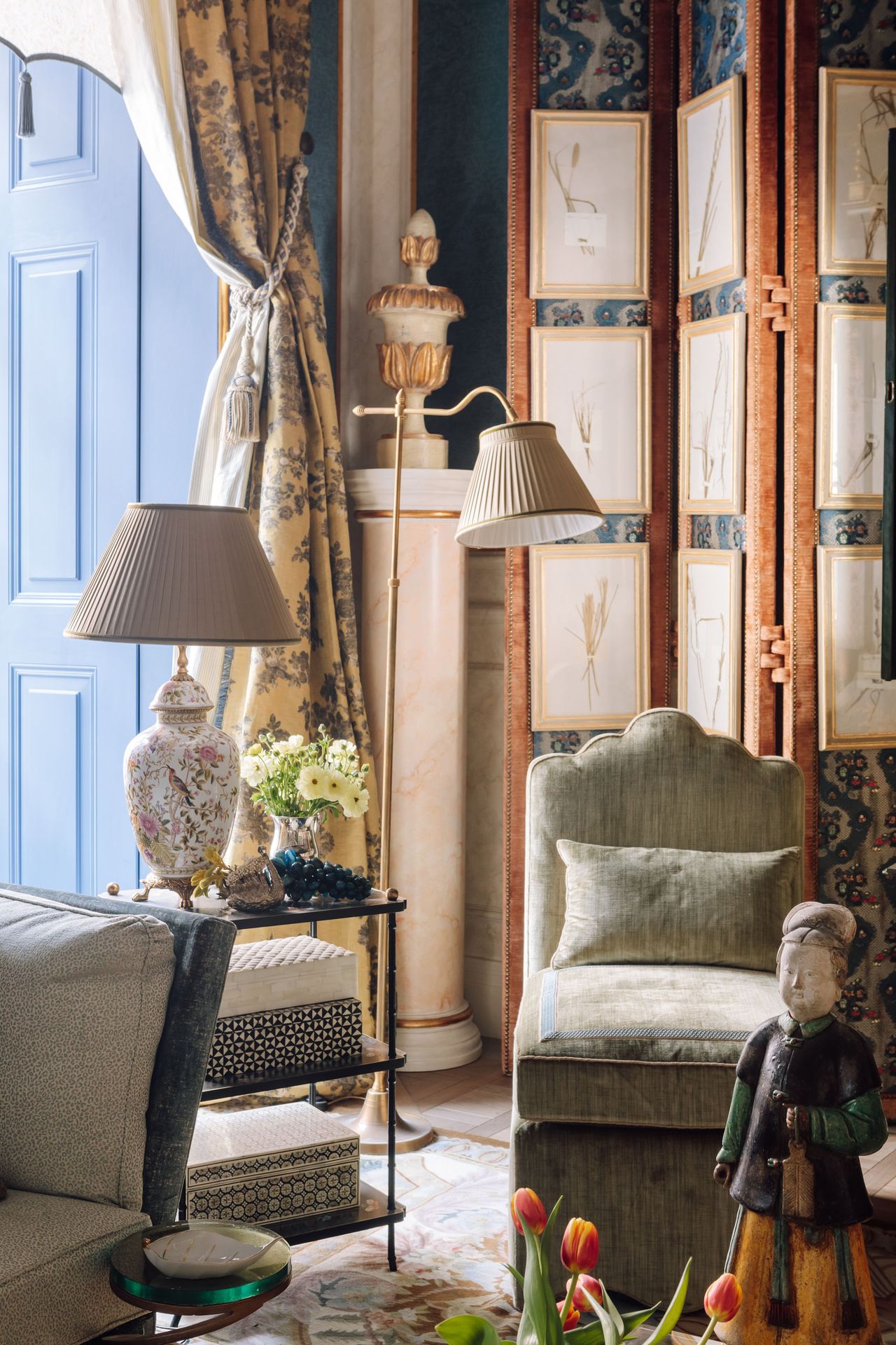 layers of textures of the yellow curtains, green chair and carpet