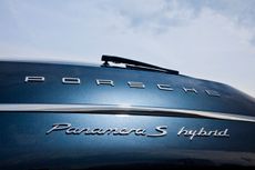 Close up of Porsche logo on car