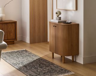 West Elm entryway with storage cabinet and rug