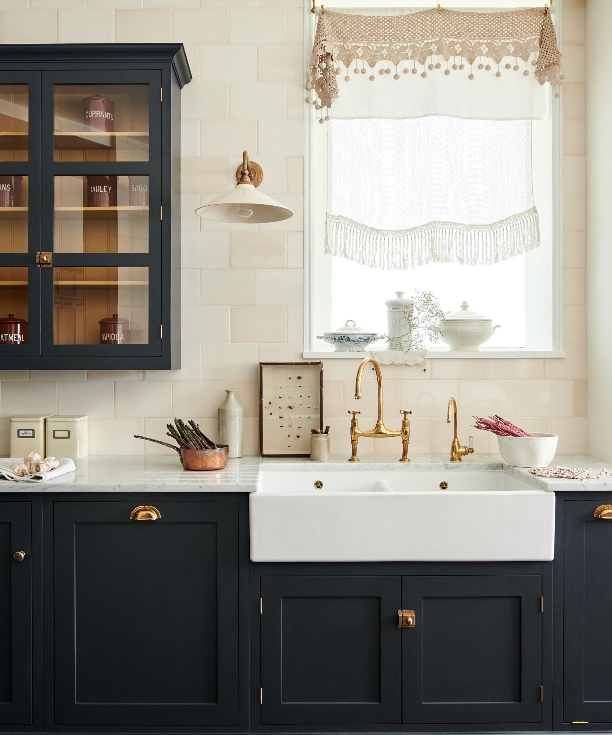 A moody deVOL kitchen with carrara marble countertops