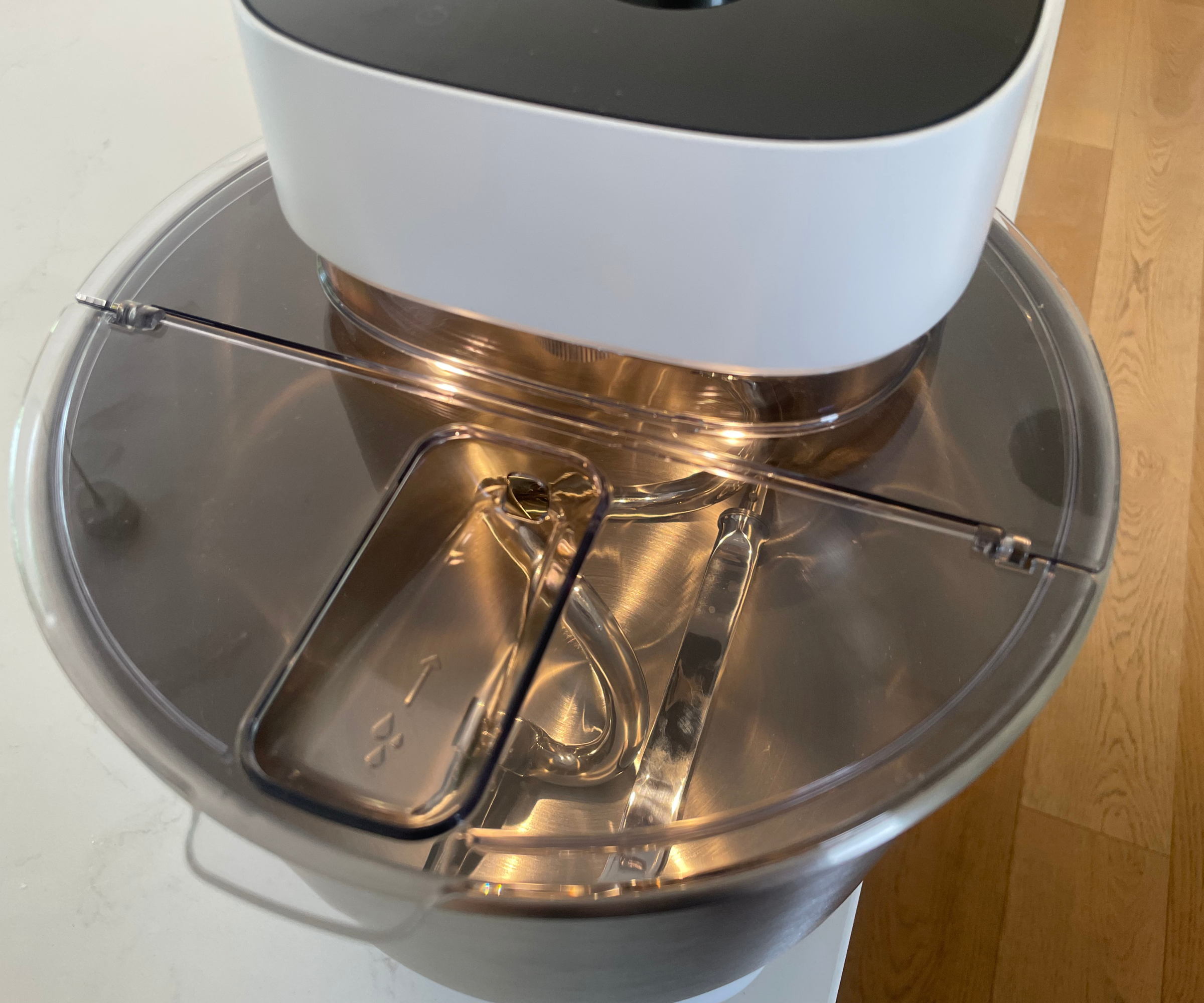 The attachments fit into the Ooni Halo Pro Spiral Mixer bowl, and the splash guard acts as a lid
