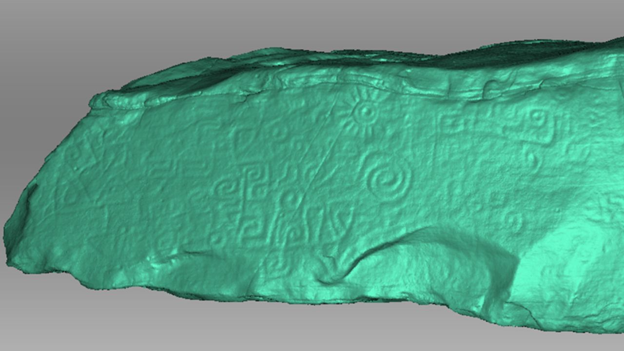A scan of the monolith is shown here in light green contrast. The contrast allows details to be seen that are harder to make out in the monolith's actual color.