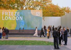 frieze entrance pavilions looking crisp in the sun and blue skies, with some people outside