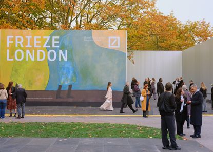 frieze entrance pavilions looking crisp in the sun and blue skies, with some people outside