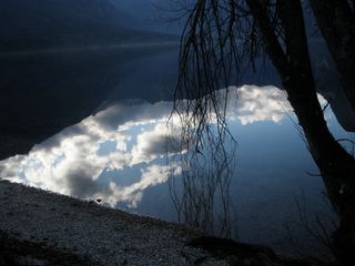 A lake reflects clouds in Slovenia.