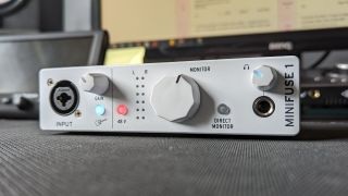 An Arturia MiniFuse 1 audio interface on a desk