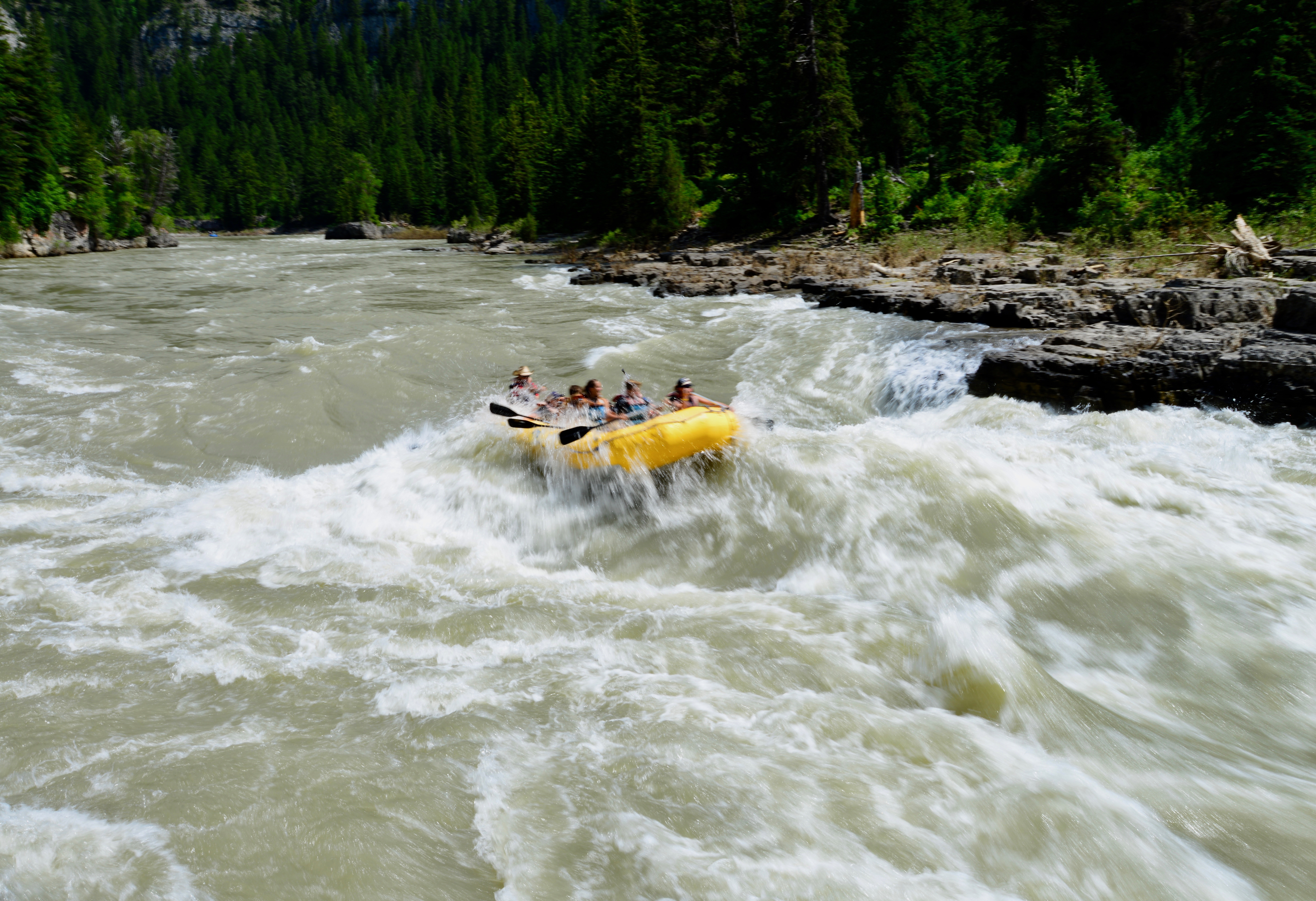 Rafters brace for Lunch Counter Rapids on the Snake River in Wyoming