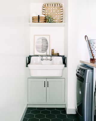 laundry room with small cabinet and sink