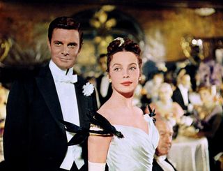 louis jourdan and leslie caron in formal wear at a gala in gigi