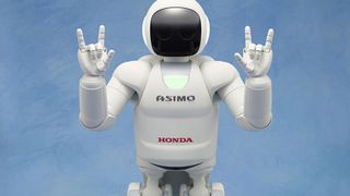 Asimo robot flexing its hands. Credit: Honda