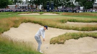 Matt Fitzpatrick takes his shot from the bunker on the 72nd hole of the 2022 US Open