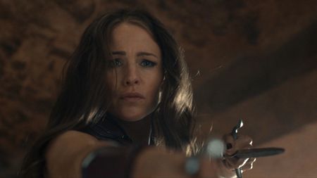 Elektra holding her sai to Deadpool 
