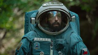 Adam Sandler's Jakub walks towards the camera in his spacesuit in Netflix's Spaceman film