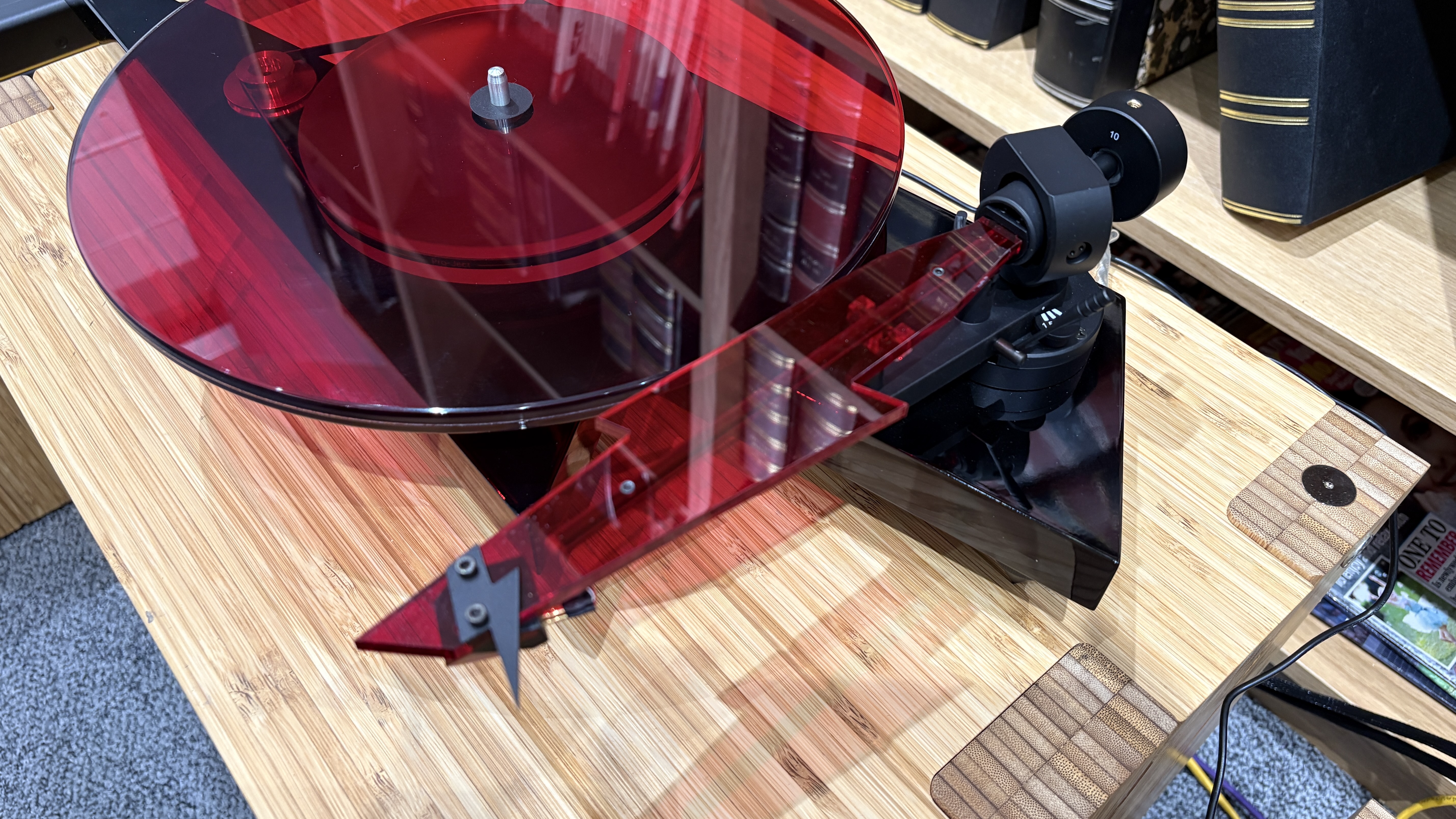 Pro-Ject AC/DC Turntable on wooden hi-fi rack