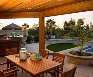 backyard with pergola covered dining area