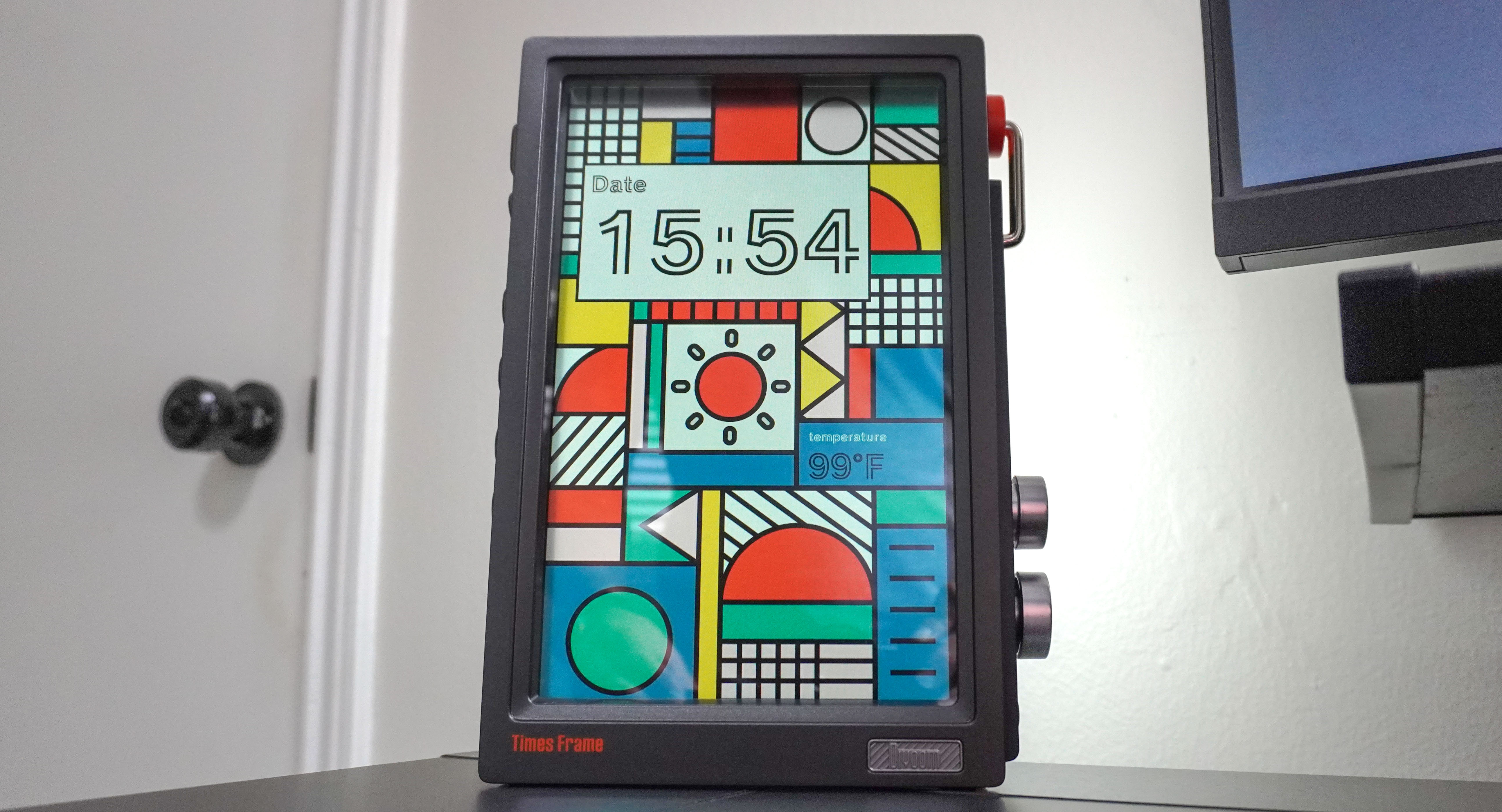 The Divoom Times Frame on the side of a desk