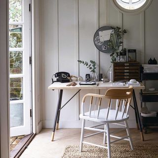 white shed with table and chair